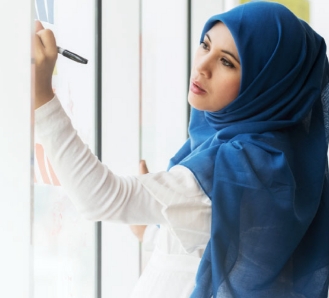 Woman with endometriosis writing on board